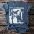 T-shirt with text "protect our national parks" and ghost, moth, and deer figures.