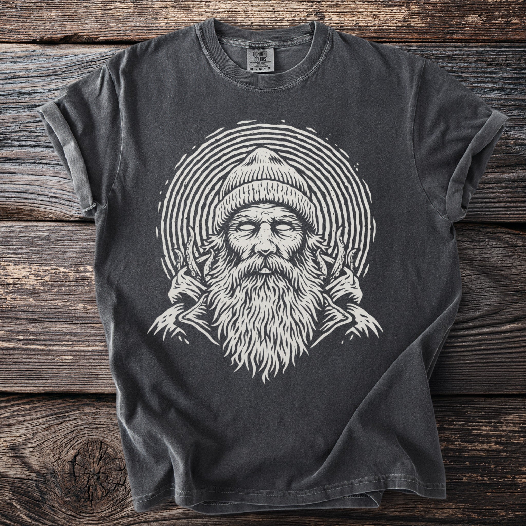 Dark gray t-shirt with a cream-colored graphic of a bearded man wearing a beanie.