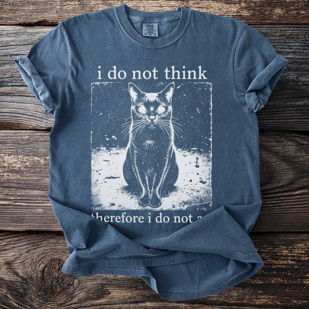 Blue t-shirt with graphic of a cat and text "i do not think therefore i do not".