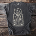 Black t-shirt with vintage graphic of a winged warrior, raven, shield, crescent moon, skulls, and flowers.