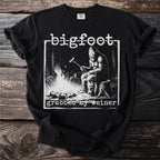 Bigfoot grilling a hot dog over a campfire with text "bigfoot grabbed my weiner".