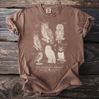 Brown t-shirt with illustrations of six owls labeled "The Wisdom Cabinet".