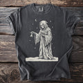 Pepper gray t-shirt with a cream folk-cut print: the hooded Reaper, skull face and tattered robe, stands in the snow ringing a small bell.