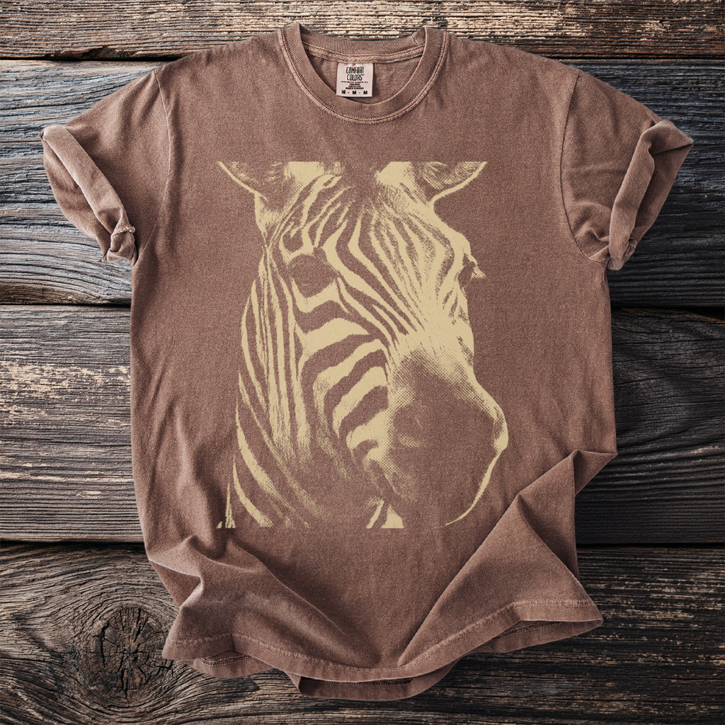 Brown t-shirt with a large cream-colored zebra head graphic.