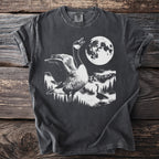 T-shirt graphic: goose under moon with mountains and trees