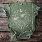 Green t-shirt with a running horse, wolf, moon, and runes in a circular design.