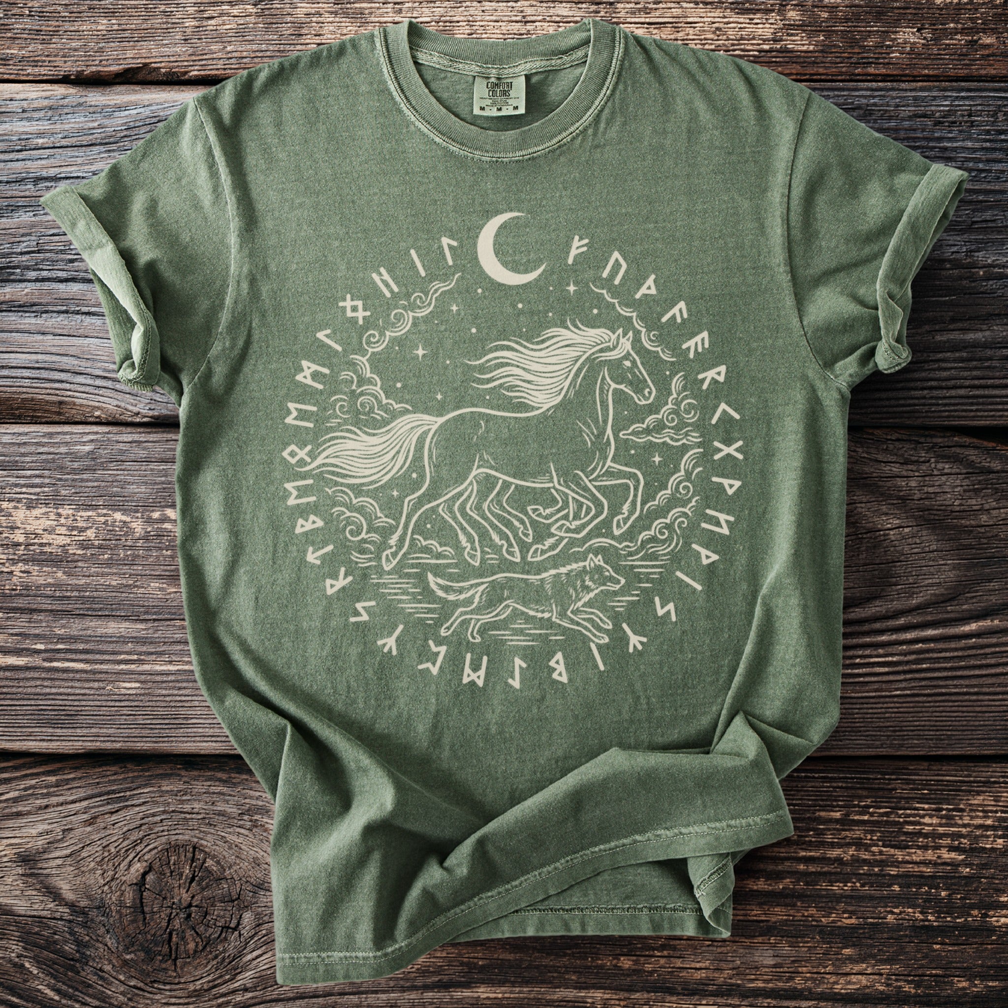 Green t-shirt with a running horse, wolf, moon, and runes in a circular design.