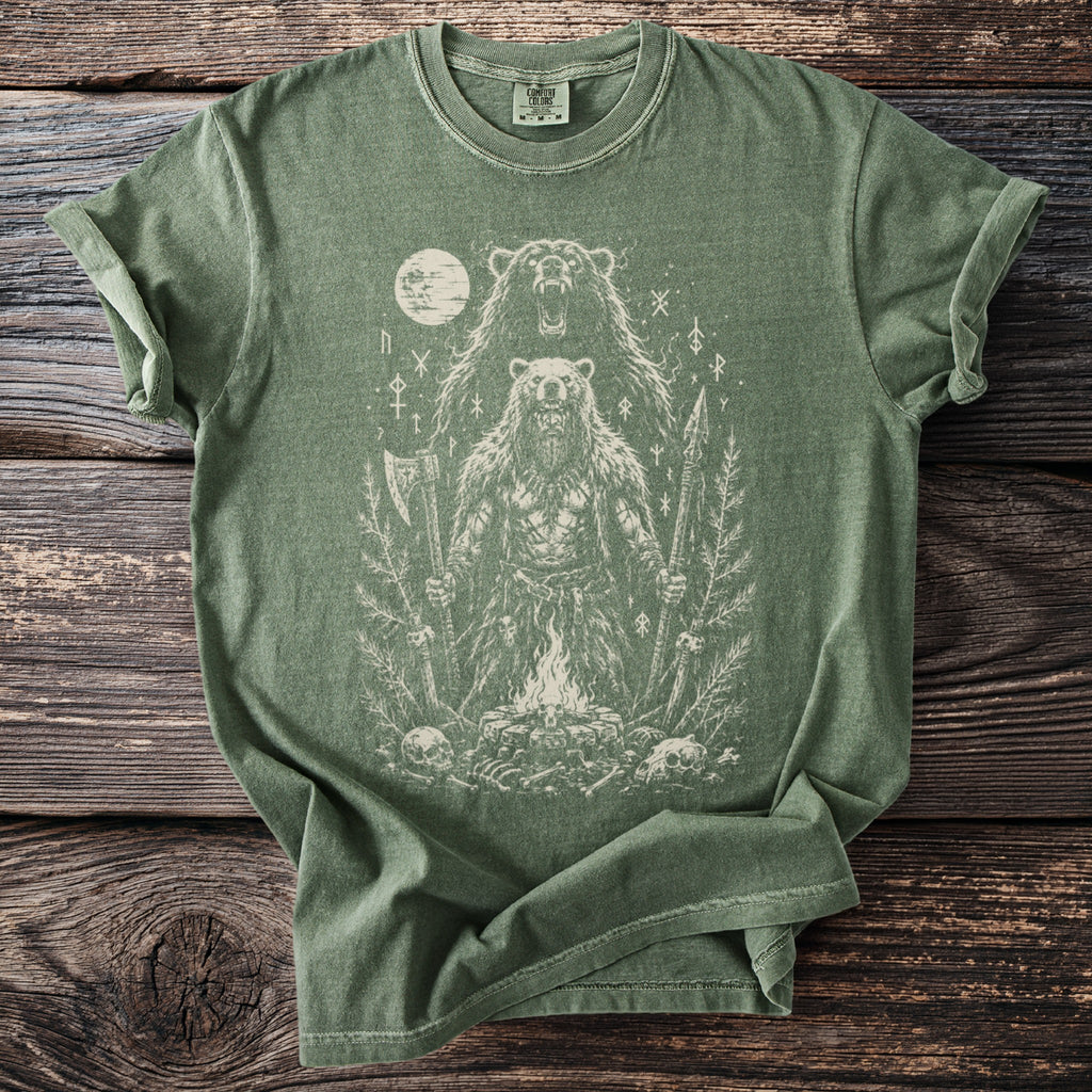Green t-shirt with distressed print of a bear-man warrior with axe and spear by campfire.