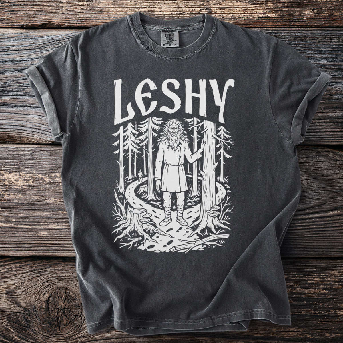 Dark gray t-shirt with white graphic of "LESHY" over a forest scene.