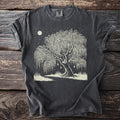 Dark gray t-shirt with a linocut style print of a weeping willow tree under a moonlit starry sky.