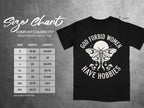 Black t-shirt size chart with "God Forbid Women Have Hobbies" graphic.