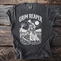 Dark gray t-shirt with white Grim Reaper design and sun graphic.