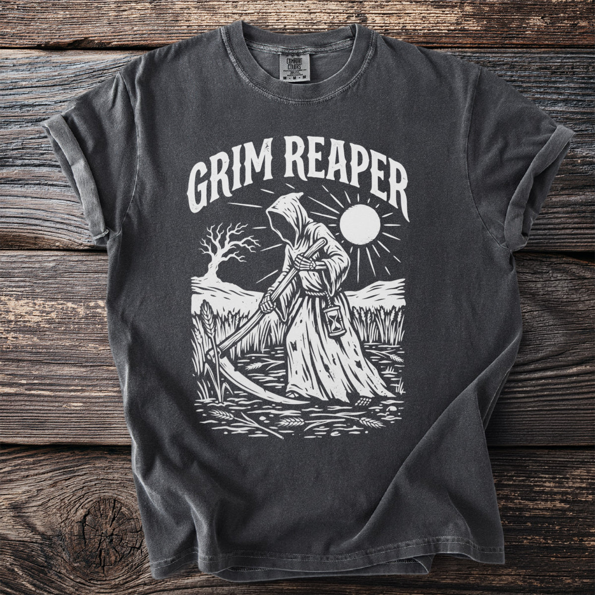 Dark gray t-shirt with white Grim Reaper design and sun graphic.
