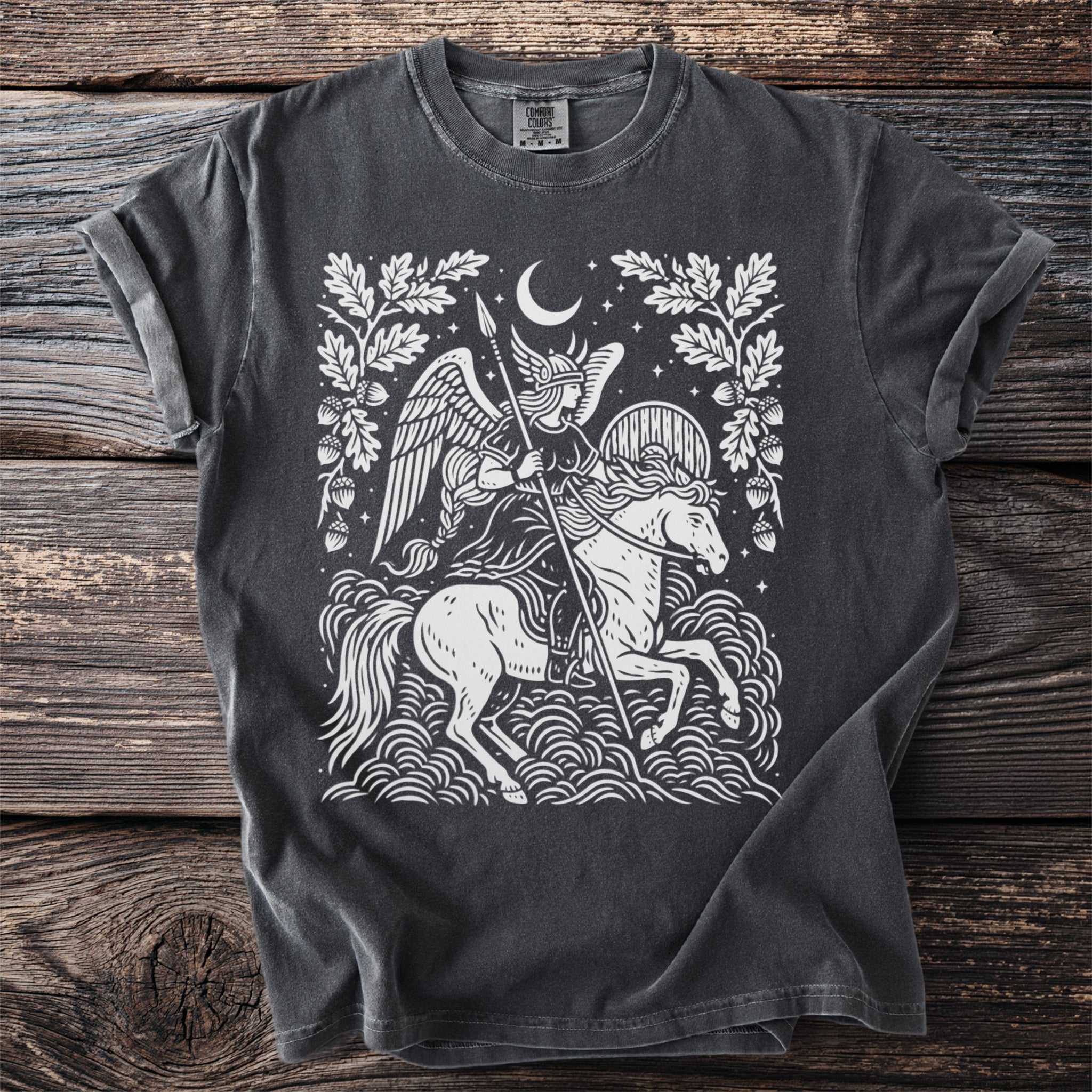Grey t-shirt featuring a white graphic of a winged warrior on a horse under a crescent moon.