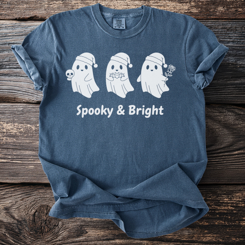 Blue t-shirt with three white ghosts, one holding a skull, text "Spooky & Bright".