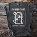Dark gray t-shirt with "The Key and the Gate" text and graphic of a gate over gravestones.