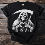 Grim reaper skeleton making a heart shape with bony hands on a black t-shirt.