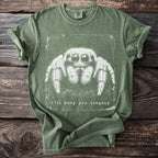 Green t-shirt with a white graphic of a spider and the text "i'll keep you company."