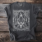 Dark grey t-shirt with white mystical illustration of a cloaked figure with crystal ball.