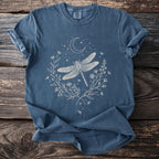 Blue t-shirt with white dragonfly, moon, stars, and floral design.