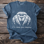Blue t-shirt with white graphic of a jumping spider and text "i'll keep you company".