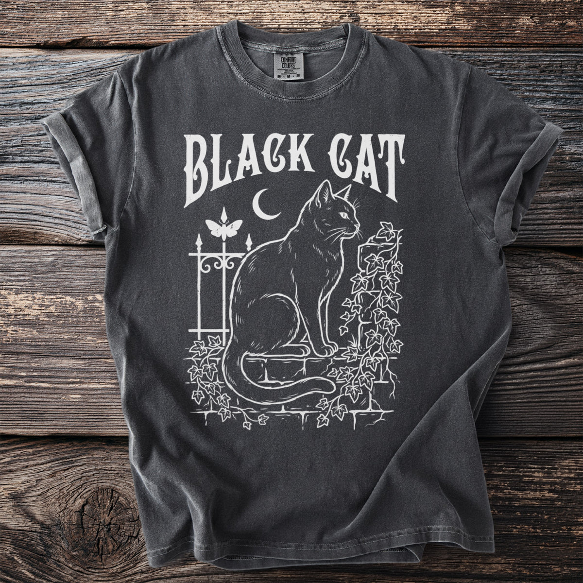 Black cat sitting on a wall with vines, moon, and butterfly, text "BLACK CAT".