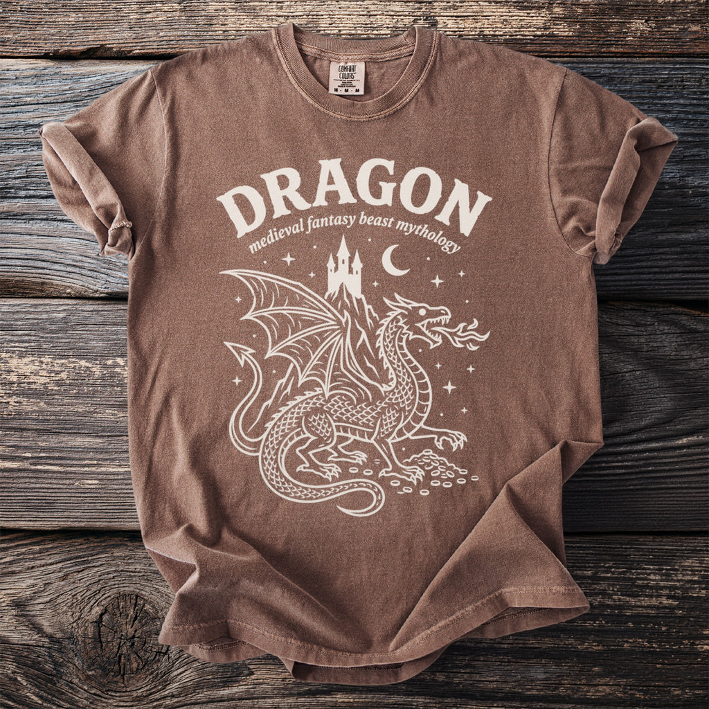 Brown t-shirt with white dragon design and text "DRAGON medieval fantasy beast mythology".