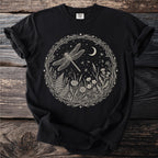 Black t-shirt with circular natural scene featuring a dragonfly, moon, and flowers.