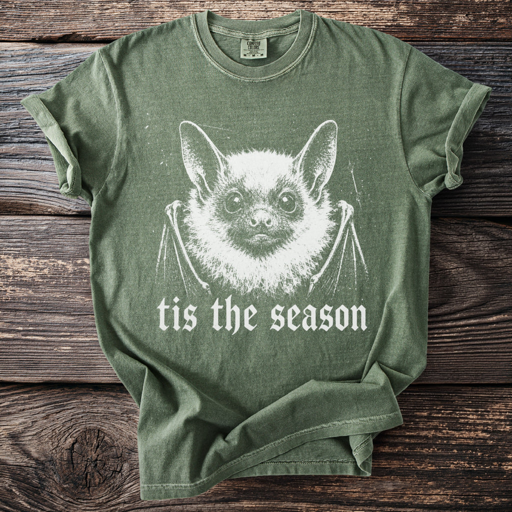 Green t-shirt with white bat graphic and text "tis the season".