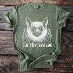 Green t-shirt with white bat graphic and text "tis the season".