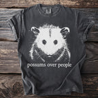 Charcoal t-shirt with a white graphic of an opossum and text "possums over people".