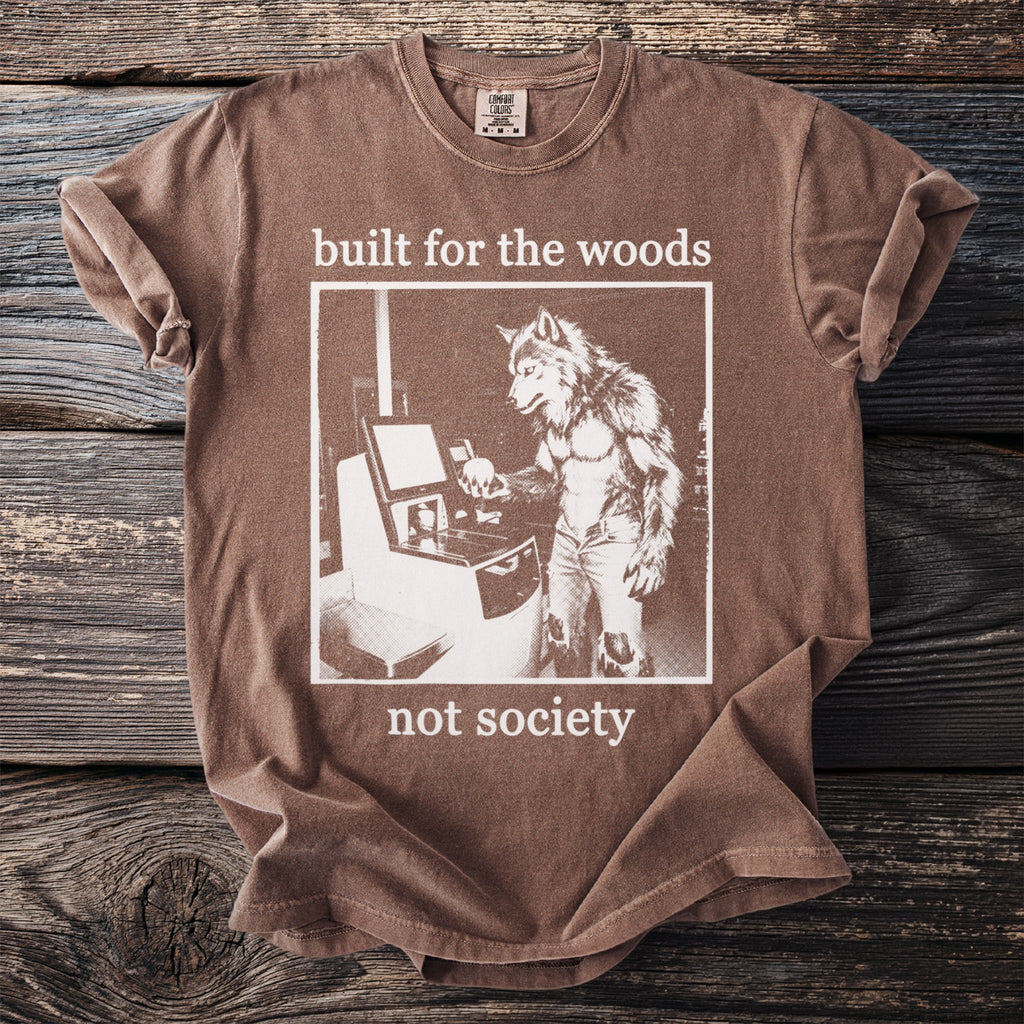 Brown t-shirt with wolfman at computer graphic and text "built for the woods not society."
