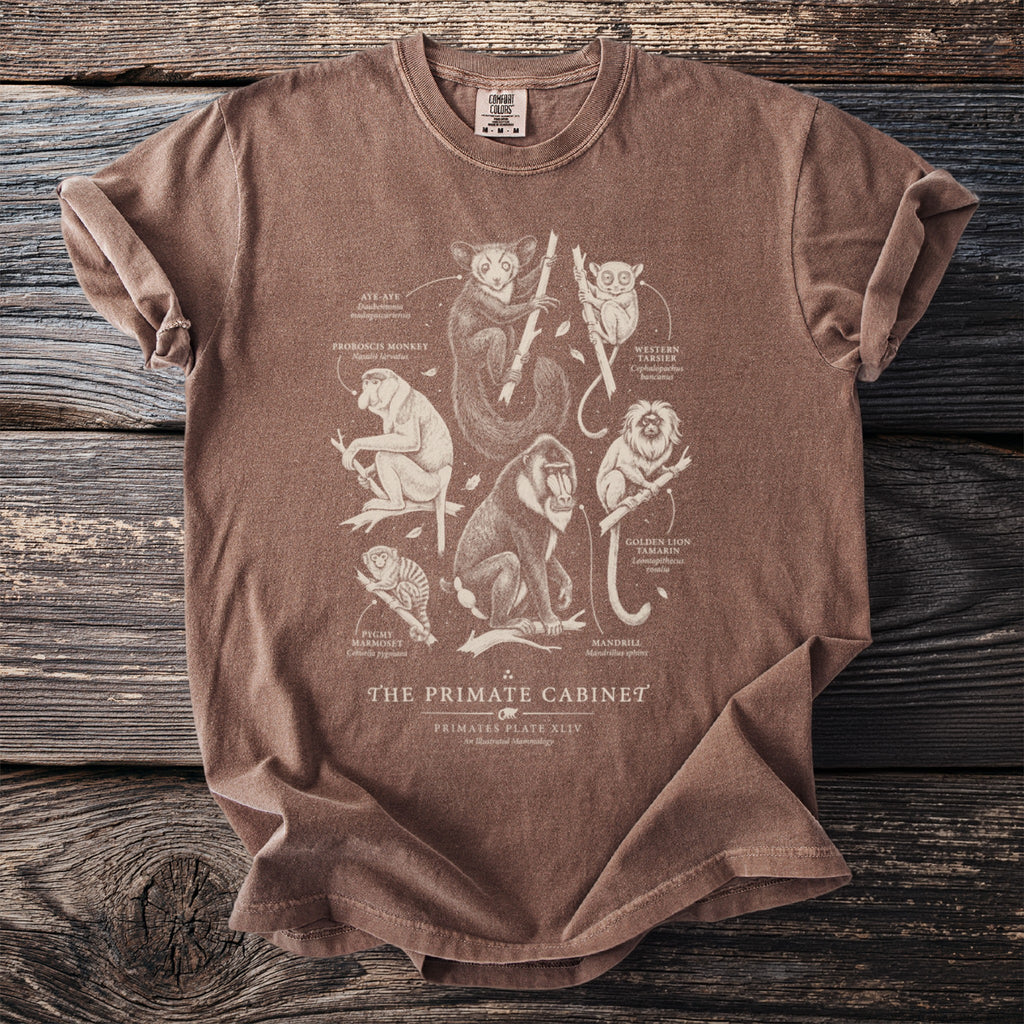 Brown t-shirt with "The Primate Cabinet" and illustrations of various primates.