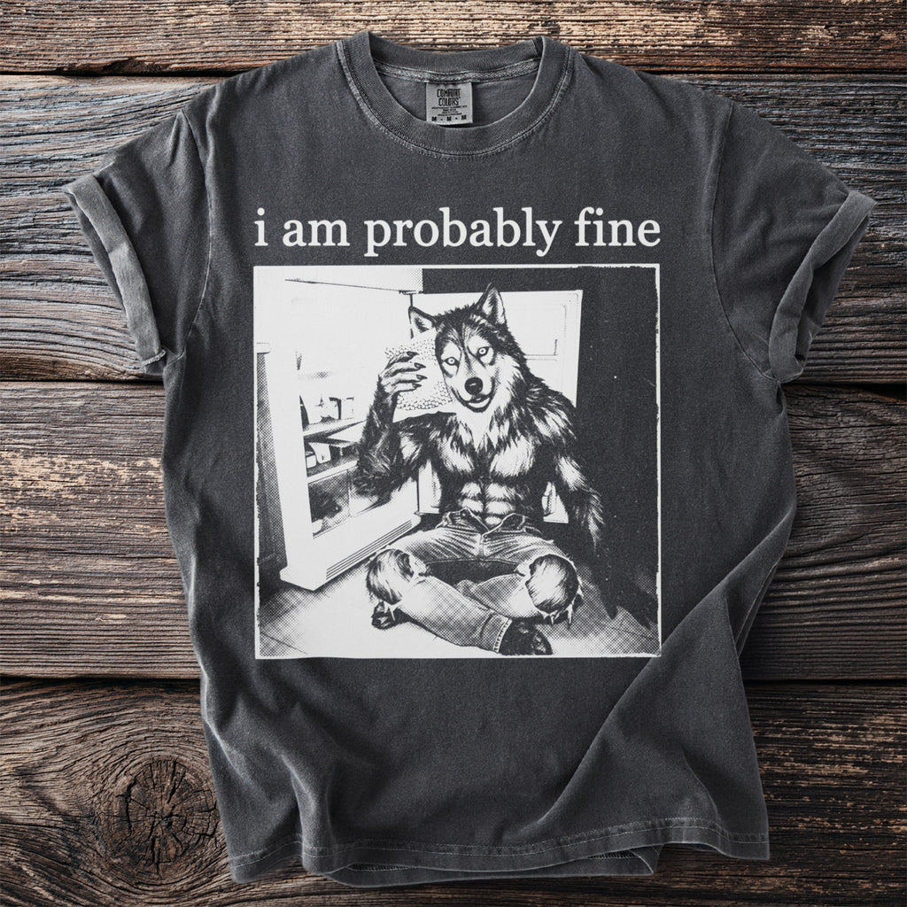 T-shirt with text "i am probably fine" and illustration of wolf-man holding food.