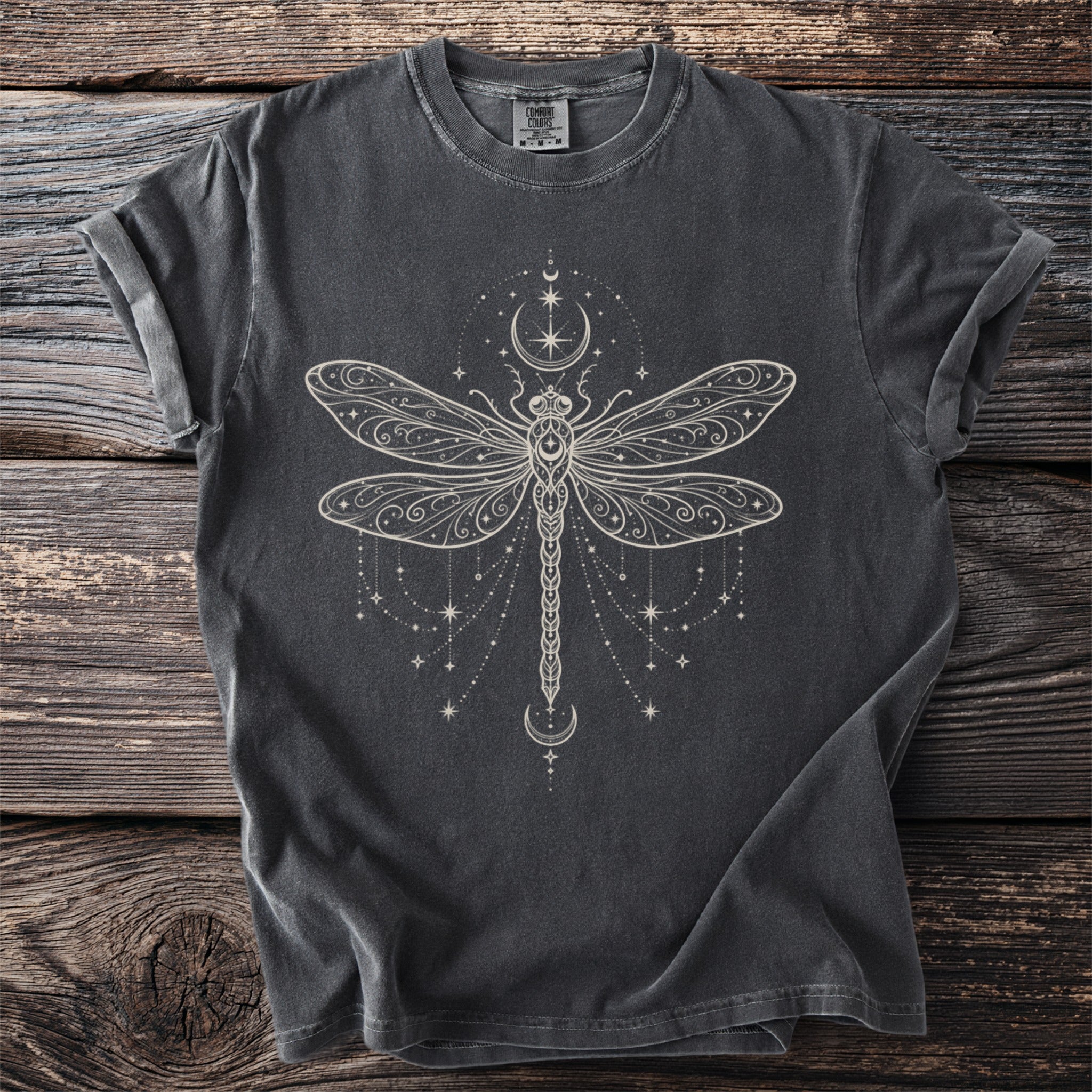 Dark grey Comfort Colors t-shirt with cream filigree dragonfly and celestial design.