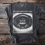 Dark gray t-shirt with "do not perceive me" above a frog in a circle graphic.
