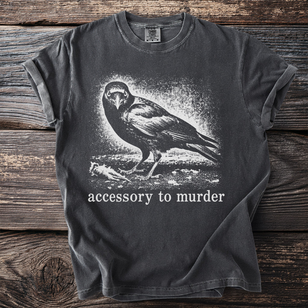 Dark gray t-shirt with graphic of a crow and text "accessory to murder".