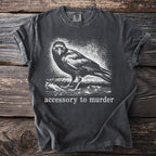 Dark gray t-shirt with graphic of a crow and text "accessory to murder".