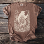 Brown t-shirt with a line art design of a Viking warrior and a bear in a forest.