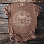 Brown t-shirt with circular dragonfly, sun, moon, and floral design.