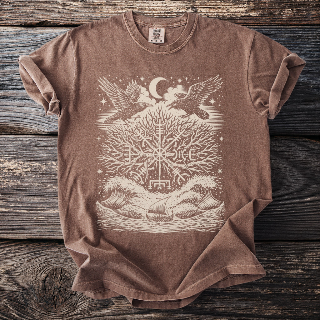 Brown t-shirt with graphic of raven-like birds, tree, moon, and viking ship.