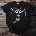 Black t-shirt with a moth-like creature blowing dandelion seeds.