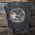 Dark gray t-shirt with a circular graphic of two rabbits among branches and a crescent moon.
