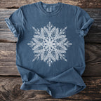 Blue t-shirt with white feather and geometric mandala graphic on front.