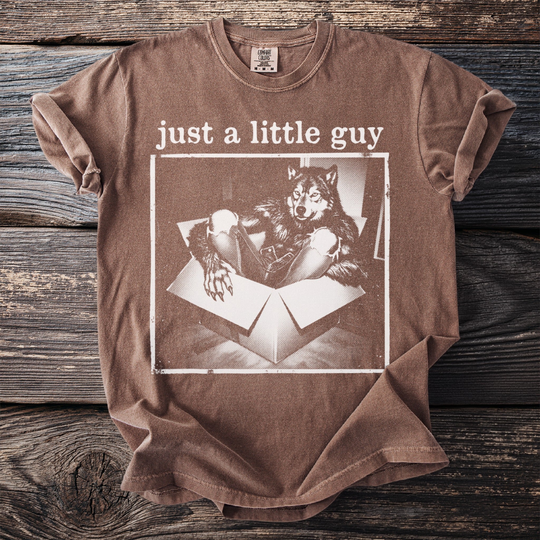Brown t-shirt with "just a little guy" text and werewolf in a box graphic.