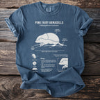 T-shirt featuring an illustration of a pink fairy armadillo with anatomical labels and biological information.
