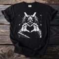 Black t-shirt with a white graphic of a horned demon making a heart shape.