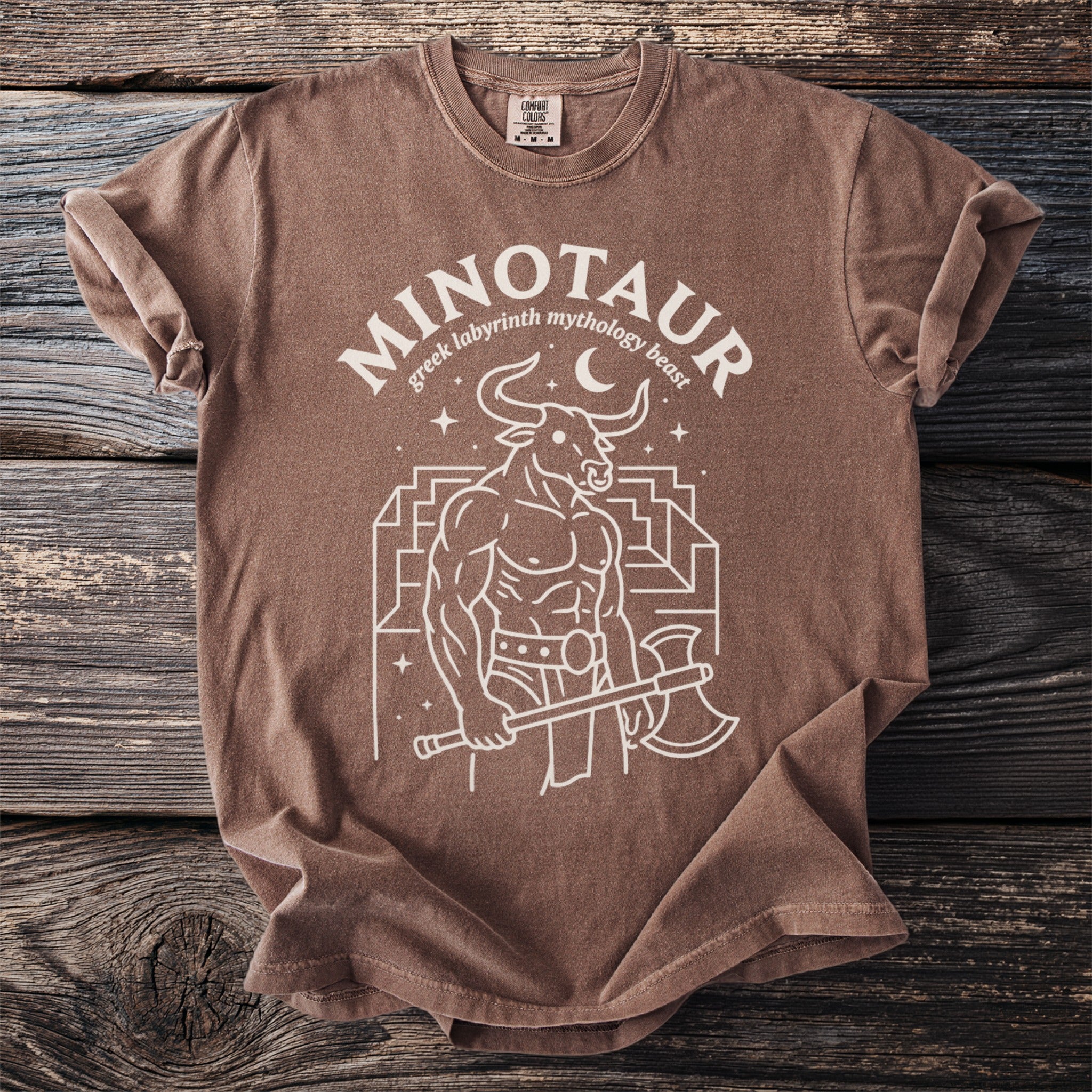 Brown t-shirt with Minotaur, labyrinth, crescent moon, and axe graphic.