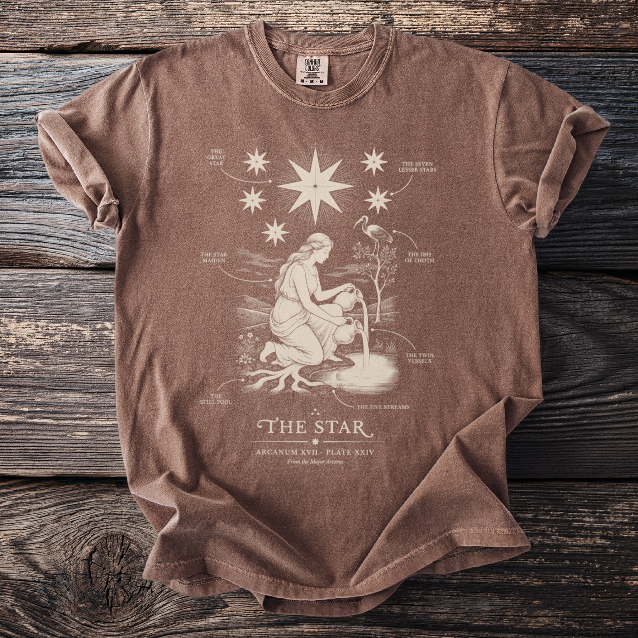 Brown t-shirt with a graphic of "The Star" tarot card and accompanying text.
