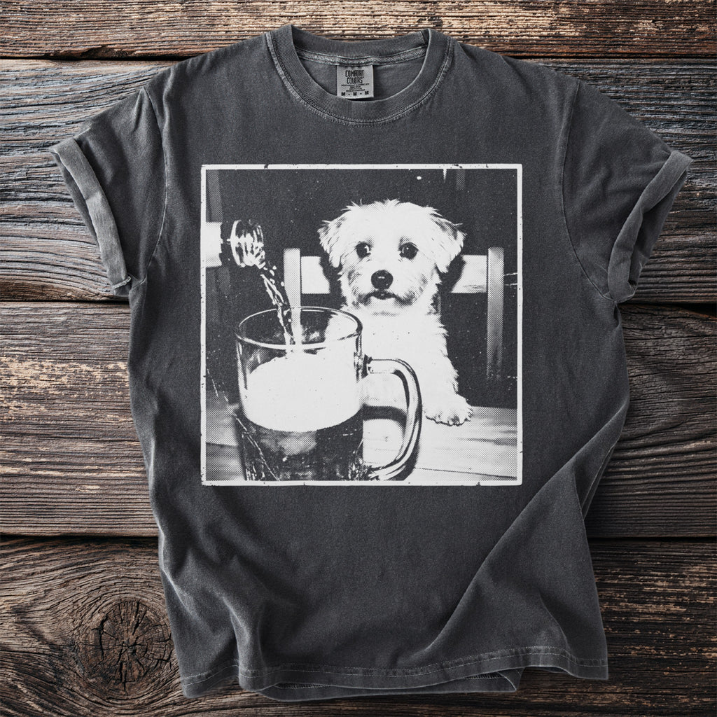 T-shirt with black and white graphic of a puppy looking at beer being poured into a mug.